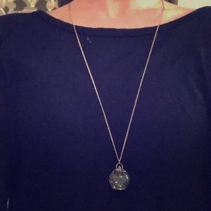 Long, crystal-glass statement necklace.